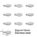 Detailed macro view of oval stainless steel extension tags with S.steel engraving - 4x10 Oval