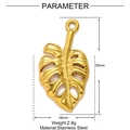 Golden stainless steel monstera leaf pendant dimensions 35mm x 19mm on white background - Monstera Leaf Style (XF140)