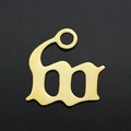 Macro detail of a gothic letter M gold plated stainless steel pendant for necklaces - Letter W (JA570-W)