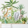 Jungle animals wall decal featuring giraffes, elephants, and tropical palm leaves - Banana Leaf Elephant Giraffe Zebra