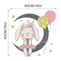 Detailed view of cartoon bunny on grey moon wall sticker with dimensions 40cm or 16in - 40x40cm