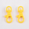 Pair of bright yellow plastic lobster clasps with rotating D-rings for DIY keychains - Yellow
