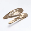 Pair of polished gold metal teardrop BB hair clips with classic snap closure - 4cm / Gold