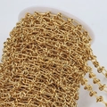 Close-up of golden twisted knot chain roll for DIY jewelry making and industrial design - 1 Meter Pack / Gold