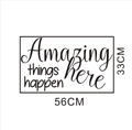 Detail of 'Amazing things happen here' vinyl wall decal with creative typography - 56x33cm / Black