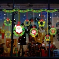 Christmas wreath window stickers featuring Santa, snowman, and reindeer for glass shop decor - Santa Reindeer Wreath Style (XH6254)