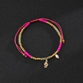 Detail of beaded bracelet with treble clef charm, pink beads and teardrop pearl pendant - Music Note