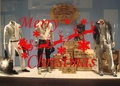 Diesel men's casual collection featuring jackets and trousers in a festive shop window display - Red / 58*37CM