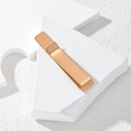 Macro shot of rose gold stainless steel tie clip on white geometric display stand - Rose Gold