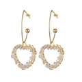 Detail of 18K gold heart-shaped earrings with hand-wrapped crystal beads on hooks - Heart Pendant (E831) / White