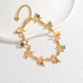 Pulsera bohemia de acero inoxidable dorado con estrellas de colores y cierre de langosta - Pulsera-Estilo Estrella (B1147-wujiaoxing)