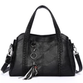 Elegant black faux leather handbag with woven handles and cat charm for women - Black