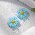 Amuletos de margaritas azules en resina para creación de joyas DIY y accesorios de pelo - Azul claro