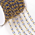 Golden stainless steel oval link chain with dark blue enamel finish on white spool - Blue