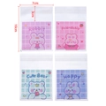 Detail view of 7x10cm clear self-adhesive bags with four cute animal prints and plaid patterns - Multicolor Strawberry Rabbit
