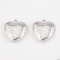 Silver vintage heart pendant with ornate floral engraving and integrated small ring loop - Floral Carving / 5 Pieces