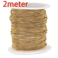 Golden round snake chain made of gold-plated stainless steel on a white spool, 2 meters - Round Snake Chain / 0.9mm Width (2 Meters/Pack)
