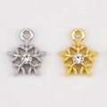 Gold and silver snowflake charms with central zircon for Christmas jewelry making - Snowflake