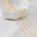 Detailed golden cross chain necklaces displayed on white textured fabric background - Gold Short Oval 2 / 1 Meter/Pack