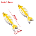 Fish bone charm in white and yellow enamel with gold metal finish and dimensions - 40X11.5mm / Yellow