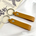 Dos llaveros de cuero PU amarillo jengibre con textura de lichi y anillo de metal plata - Naranja Hebilla Plateada
