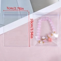 Pochette bijoux transparente 7x10cm en PVC pour bracelets et boucles d'oreilles - 7x10cm