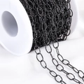 DIY black textured oval link metal jewelry chain on a white spool for handicraft projects - Oval Link Chain
