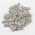 Polished silver floral metal spacer beads for DIY jewelry making and craft projects - 4mm (100 Pieces Pack) / Silver