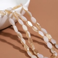 Faceted oval beads in cream and champagne with cat-eye effect for DIY jewelry - 60 Pieces/Pack / Solid Half Brown Half Jelly White