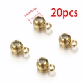 20-piece pack of 4mm golden stainless steel spacer beads with silicone core and loop - Gold