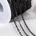 Matte black stainless steel oval link chain on white spool for DIY jewelry making - 7x2.5mm Paris Flat Wire Chain