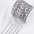 Silver flower-shaped stainless steel chain on a white spool for DIY jewelry making - Wavy Edge Shape / 1 Meter / Steel