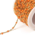 Gold plated stainless steel bead chain with orange enamel accents on white spool - Golden Orange