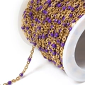 Golden stainless steel bead chain with purple enamel accents on a white spool for DIY jewelry - Gold Purple