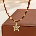 Luxury 18k gold plated star pendant necklace with crystal inlay and brown leather cord - Rhinestone Star Style (S-N2298-B)
