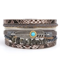 Detail of layered leather bracelet with silver feather pendant and turquoise stone bead - Gray