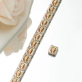 Macro detail of modular Italian charm bracelet with gold enamel train icons - Gold Train Style (HA-38)