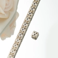 Macro shot of silver stainless steel charm bracelet links with golden leopard print patterns - Gold Leopard Print Style (HA-34)