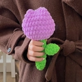 Handmade crochet tulip flower ornament in purple yarn, held in hand, soft texture - Purple