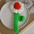 Handmade crochet chamomile flower in red and white colors with green leaf stem decor - Red