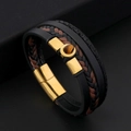 Detailed view of handmade leather bracelet featuring golden magnetic clasp and tiger eye stone - Black and Gold Style