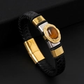 Bracciale da uomo in pelle nera intrecciata con chiusura dorata e pietra occhio di tigre - Nero + Oro