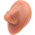 Detailed view of a silver nose chain with a sparkling round zircon on a silicone model - Silver Rhinestone Nose Chain (#3)