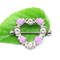 Close-up of heart-shaped nipple ring with purple roses and sparkling rhinestones - Platinum