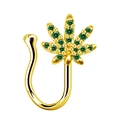 Detail of gold nose clip featuring a green zircon maple leaf design on white background - Gold Green Rhinestone Leaf