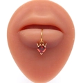 Golden heart lip ring with red zircon and devil horn detail on silicone lip model - Gold Red Devil Heart Style (#2)