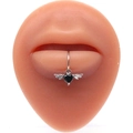 Detail of a lip ring featuring a black heart gemstone with wings on a silicone model - Silver Black Winged Heart Style (#9)