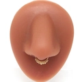 Macro detail of a golden faux septum ring with beaded accents on a silicone nose model - Gold Gradient Beaded Style (#9)