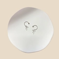 Detail of silver bow nipple rings with sparkling white zircons in a C-shape design - Zirconia Bowknot Style (23071932)