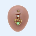 Piercing de nombril coeur doré avec gemme verte et barre de 1,6 mm sur modèle silicone - Cœur Vert Creux Doré (#5) / 1.6mm x 10mm